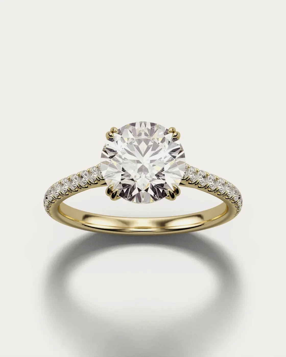 Photoreal render of the same pavé solitaire ring in yellow gold