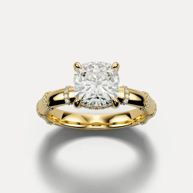 Station Halo: a cushion diamond ring in 18K yellow gold with pavé stations, rendered from the catalog model